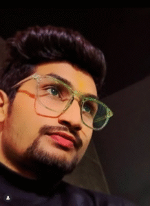Person with stylish hair and attire.